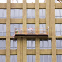 Highlanders insulate the high-rise building of the mineral cotton